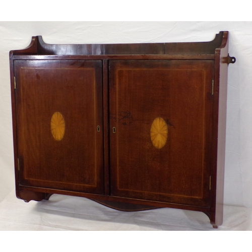 62 - Edwardian inlaid mahogany medicine cabinet or press with shelved interior, shell inlay, and shaped s... 