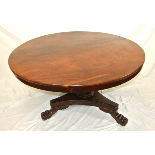 65 - William IV round mahogany centre or library table with tip-up top, hexagonal tape ring column, with ... 