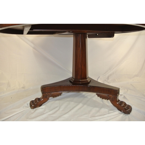 65 - William IV round mahogany centre or library table with tip-up top, hexagonal tape ring column, with ... 