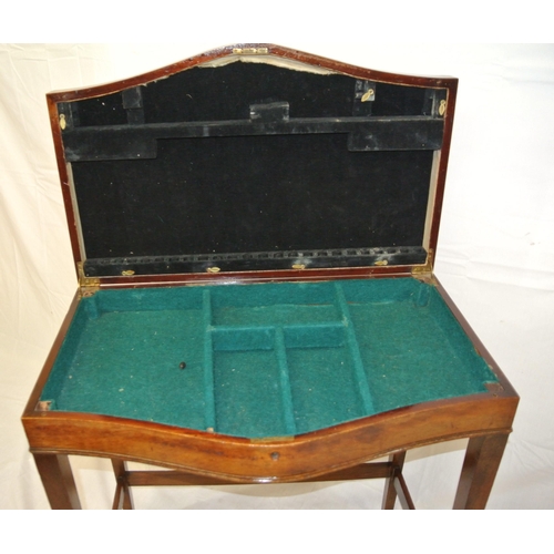 81 - Edwardian mahogany serpentine fronted canteen table with sectioned interior, and tapering legs with ... 