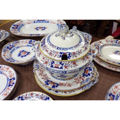 82 - Thirty eight piece assorted Ironstone dinner service with ornate foliate decoration