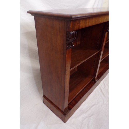 20 - Edwardian mahogany open bookcase with scroll decoration, adjustable shelving, on oblong plinth