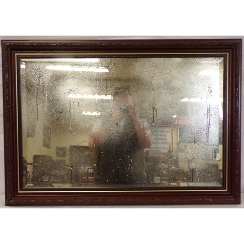 192 - Edwardian bevelled glass wall mirror with foliate frame