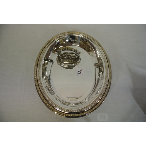 11 - Oval silverplated entree dish with detachable lid and handle and beaded decoration