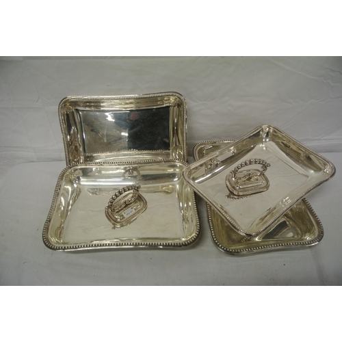 19 - Pair of silver plated entree dishes with beaded decoration and shaped detachable handles