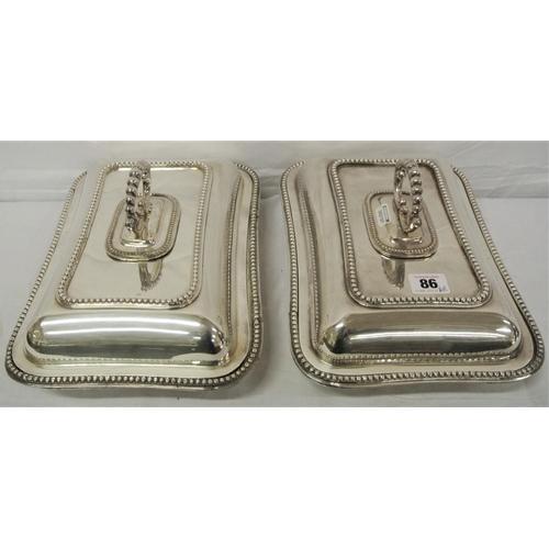 19 - Pair of silver plated entree dishes with beaded decoration and shaped detachable handles