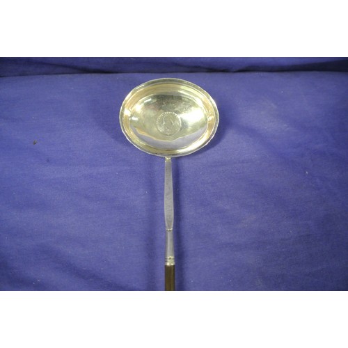 137 - Georgian style silverplated toddy ladle with twist reeded handle and oval bowl with coin inset