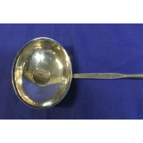 137 - Georgian style silverplated toddy ladle with twist reeded handle and oval bowl with coin inset