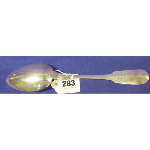 283 - Irish silver serving spoon with crested fiddle pattern handle, by Richard Garde, Cork 1805, 23cm, 75... 