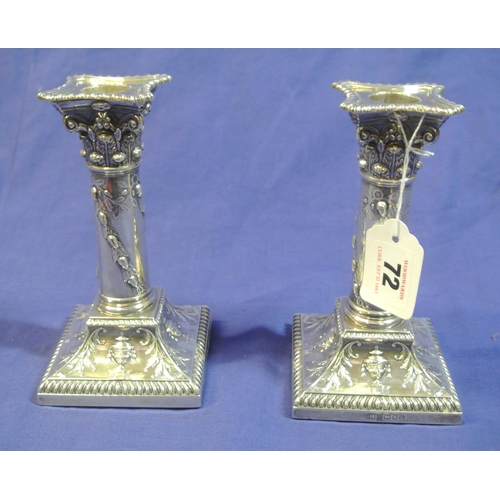 72 - Pair of London silver dwarf candlesticks with foliate and urn decoration, detachable sconces, on ste... 