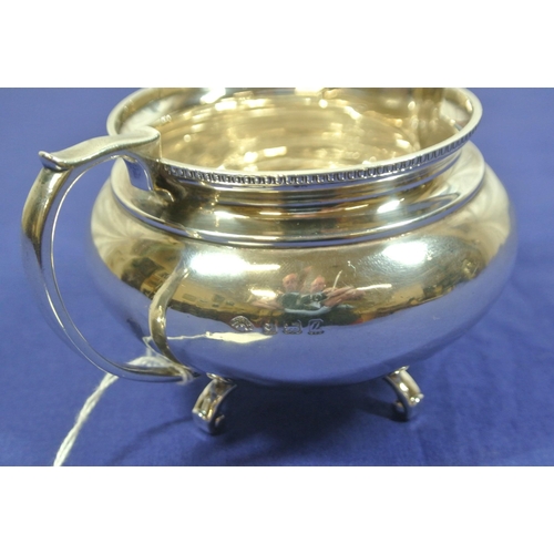 78 - Birmingham silver round creamewer with beaded rim and shaped handle, on 4 scroll feet