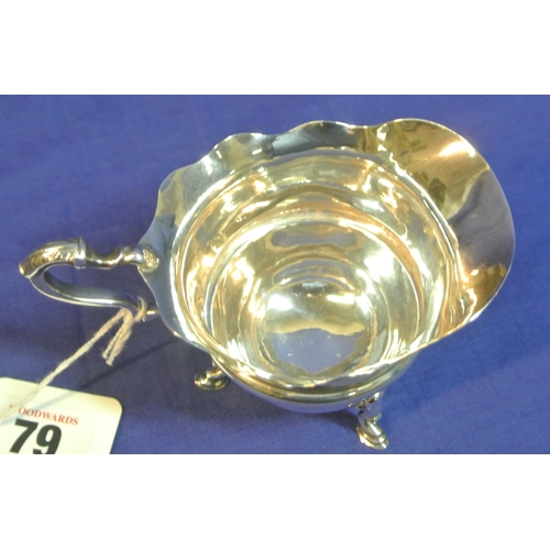 79 - Birmingham silver creamewer with wavy rim, shaped handle, on 3 hoof feet