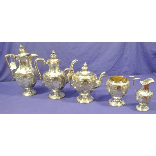 87 - 5 Piece Victorian Birmingham silver tea service, with shaped finials, profusely embossed with shamro... 