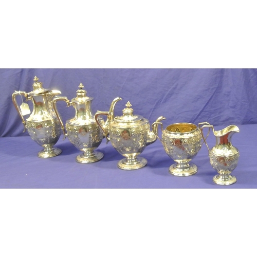 87 - 5 Piece Victorian Birmingham silver tea service, with shaped finials, profusely embossed with shamro... 