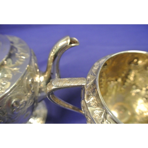 87 - 5 Piece Victorian Birmingham silver tea service, with shaped finials, profusely embossed with shamro... 