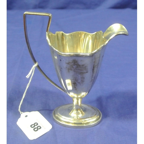 88 - Edwardian London silver creamewer with reeded rim and handle, on oval stepped base. Dated 1905