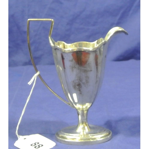 88 - Edwardian London silver creamewer with reeded rim and handle, on oval stepped base. Dated 1905