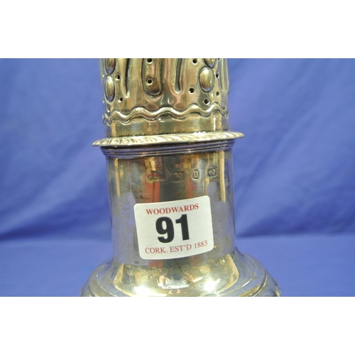 91 - Large Birmingam silver sugar caster with finial, reeded decoration, on spreading base. 28cm