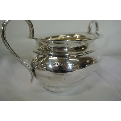 85 - 4 piece Sheffield silver tea service of oval form with shaped handles and stepped bases, 20cm, total... 