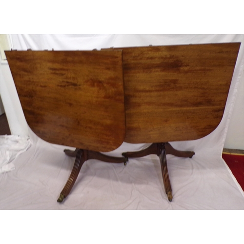 25 - Edwardian mahogany twin pillar dining table with reeded borders, raised on turned columns with reede... 