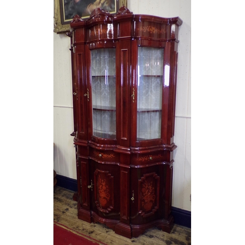 125 - French style serpentine fronted display cabinet with scroll decorated pediments, foliate inlay, shap... 