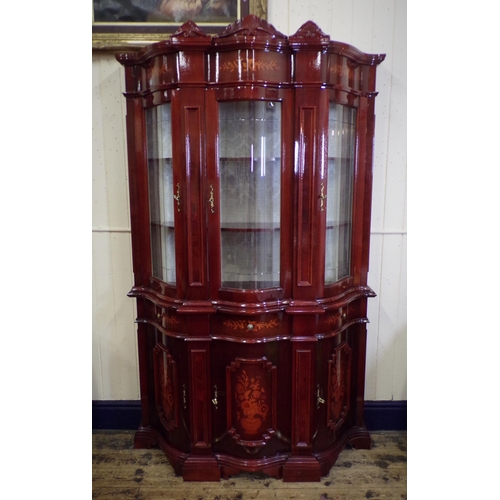 125 - French style serpentine fronted display cabinet with scroll decorated pediments, foliate inlay, shap... 