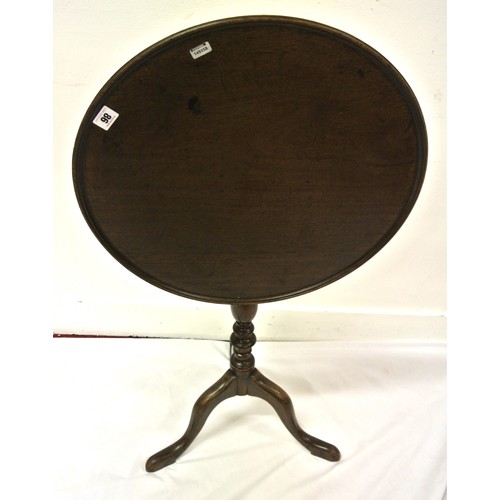 126 - Victorian mahogany round occasional table with tip-up top, baluster turned column, on hipped tripod