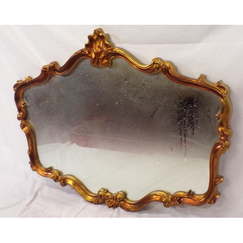 127 - Regency design wall mirror with ornate scroll and shell decoration