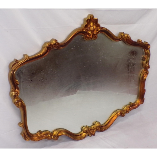 127 - Regency design wall mirror with ornate scroll and shell decoration