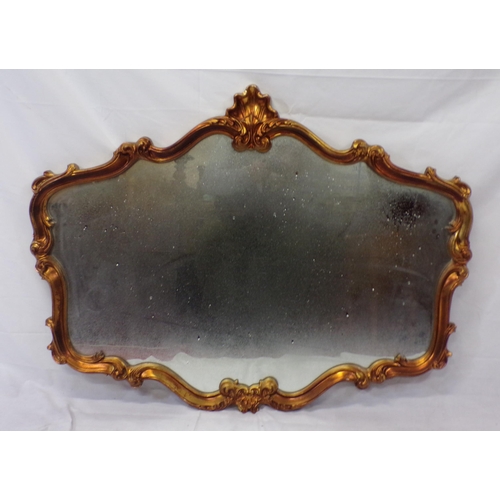 127 - Regency design wall mirror with ornate scroll and shell decoration