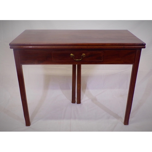 130 - Georgian style mahogany tea table with fold-over top,  pull-out gateleg support, frieze drawer with ... 