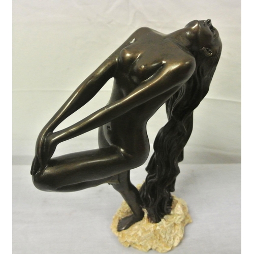 136 - Ornate bronzed ornament of a nude, on rocky base