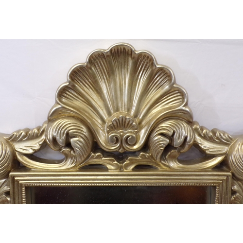 141 - Ornate gilt framed wall mirror with shell and foliate decoration