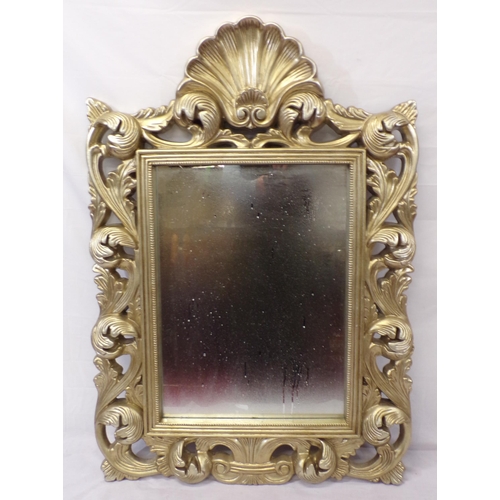 141 - Ornate gilt framed wall mirror with shell and foliate decoration