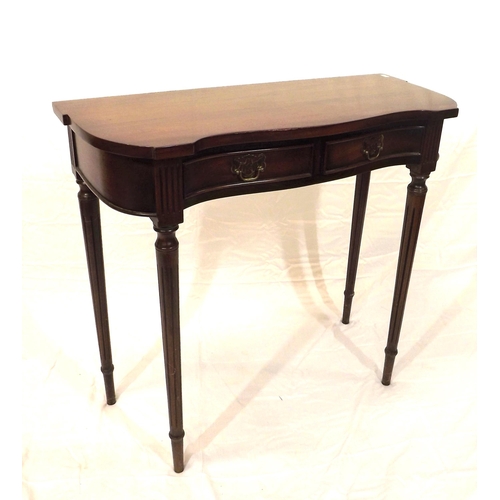 129 - Edwardian mahogany hall or side table with serpentine front, two frieze drawers with brass drop hand... 
