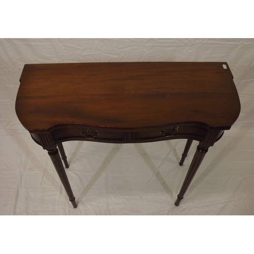 129 - Edwardian mahogany hall or side table with serpentine front, two frieze drawers with brass drop hand... 