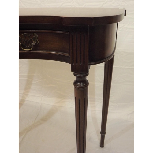 129 - Edwardian mahogany hall or side table with serpentine front, two frieze drawers with brass drop hand... 