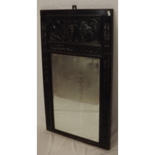 134 - Arts & Crafts carved oak framed bevelled glass wall mirror with foliate decoration