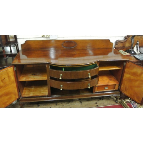 145 - Edwardian mahogany bow fronted sideboard with tray back, two central drawers, shelved side presses w... 