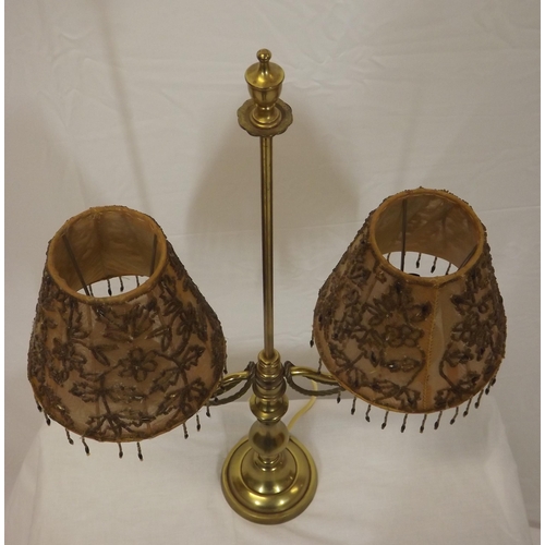 147 - French style double electric lamp with shaped tassels and round base.