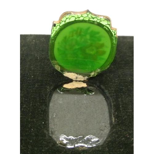 168 - Set of seven foliate decorated enamel and green glass jar tops in presentation case