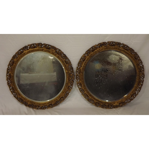 17 - Pair of Edwardian style round bevelled glass wall mirrors with ornate foliate decoration