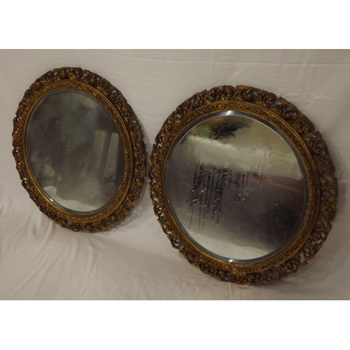 17 - Pair of Edwardian style round bevelled glass wall mirrors with ornate foliate decoration