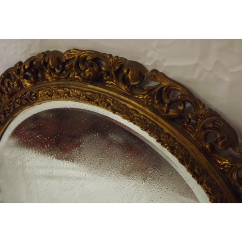 17 - Pair of Edwardian style round bevelled glass wall mirrors with ornate foliate decoration