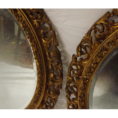17 - Pair of Edwardian style round bevelled glass wall mirrors with ornate foliate decoration