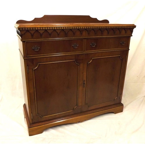 20 - Edwardian style yew cabinet with dentil frieze, two frieze drawers with shelved press under, on brac... 
