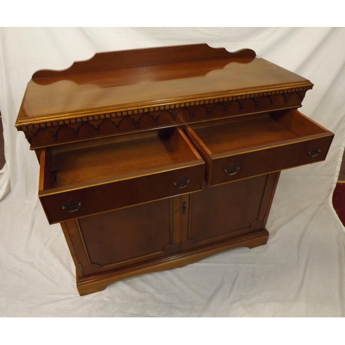 20 - Edwardian style yew cabinet with dentil frieze, two frieze drawers with shelved press under, on brac... 