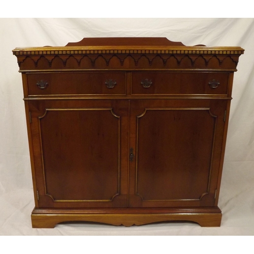 20 - Edwardian style yew cabinet with dentil frieze, two frieze drawers with shelved press under, on brac... 