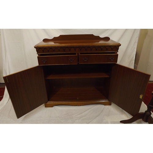 20 - Edwardian style yew cabinet with dentil frieze, two frieze drawers with shelved press under, on brac... 
