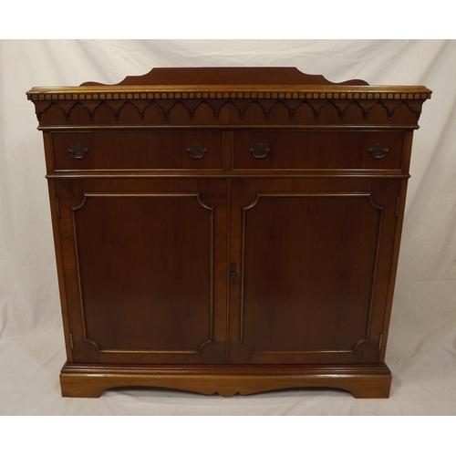 20 - Edwardian style yew cabinet with dentil frieze, two frieze drawers with shelved press under, on brac... 